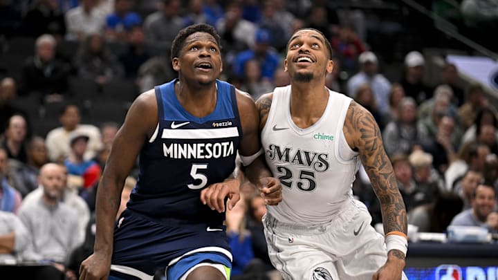 Jan 22, 2025; Dallas, Texas, USA; Minnesota Timberwolves guard Anthony Edwards (5) and Dallas Mavericks forward P.J. Washington (25) look for the ball during the second half at the American Airlines Center. Mandatory Credit: Jerome Miron-Imagn Images