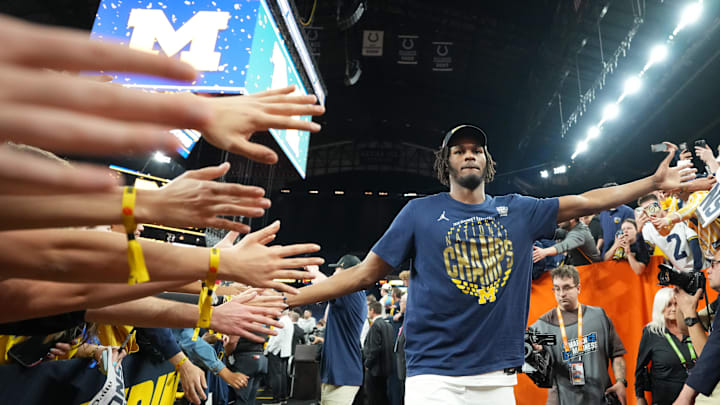 Apr 6, 2026; Indianapolis, IN, USA; Michigan Wolverines forward Morez Johnson Jr. (21) with fans after the National Championship of the Final Four of the men's 2026 NCAA Tournament at Lucas Oil Stadium. Mandatory Credit: Bob Donnan-Imagn Images