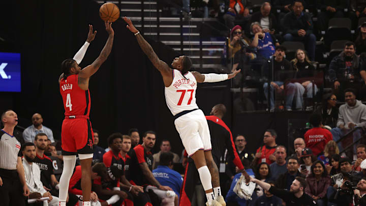 Dec 8, 2024; Inglewood, California, USA; Houston Rockets guard Jalen Green (4) shoots against LA Clippers guard Kevin Porter Jr. (77) during the first quarter at Intuit Dome. Mandatory Credit: Jason Parkhurst-Imagn Images