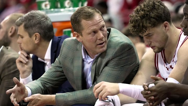 Wisconsin associate head coach John Krabbenhoft talks with guard Max Klesmit (11) during the first half of their preseason game against UW-River Falls Wednesday, October 30, 2024 at the Kohl Center in Madison, Wisconsin.