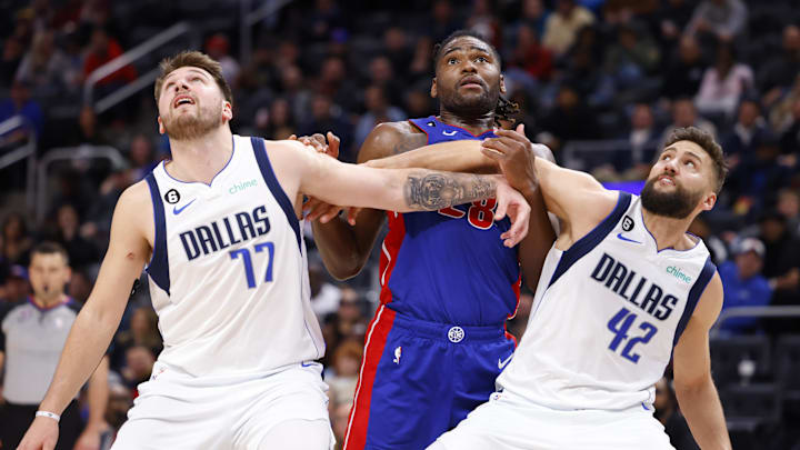 Dec 1, 2022; Detroit, Michigan, USA; Dallas Mavericks guard Luka Doncic (77) and forward Maxi Kleber (42) box out Detroit Pistons center Isaiah Stewart (28) in overtime at Little Caesars Arena. Mandatory Credit: Rick Osentoski-Imagn Images