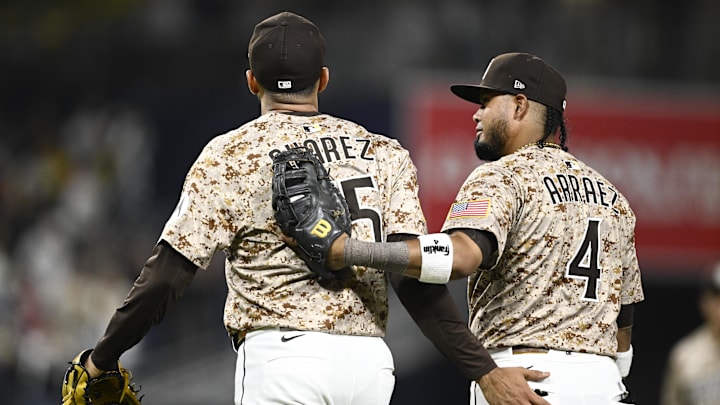 Jul 6, 2025; San Diego, California, USA; San Diego Padres relief pitcher Robert Suarez (75) and Luis Arraez (4) leave the field after the Padres beat the Texas Rangers 4-1 at Petco Park. Mandatory Credit: Denis Poroy-Imagn Images Jul 6, 2025; San Diego, California, USA; San Diego Padres relief pitcher Robert Suarez (75) and Luis Arraez (4) leave the field after the Padres beat the Texas Rangers 4-1 at Petco Park. Mandatory Credit: Denis Poroy-Imagn Images