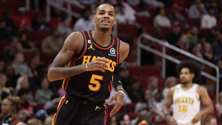 Nov 25, 2022; Houston, Texas, USA;  Atlanta Hawks guard Dejounte Murray (5) celebrates his three point basket against the Houston Rockets in the second quarter at Toyota Center.