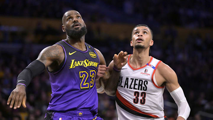 Jan 2, 2025; Los Angeles, California, USA; Los Angeles Lakers forward LeBron James (23) boxes out Portland Trail Blazers forward Toumani Camara (33) in the first half at Crypto.com Arena. Mandatory Credit: Jayne Kamin-Oncea-Imagn Images