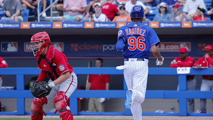 Feb 26, 2023; Port St. Lucie, Florida, USA; New York Mets outfielder Alex Ramirez crosses the plate to score as Washington Nationals catcher Brady Lindsly waits on the ball during the seventh inning at Clover Park. Mandatory Credit: Reinhold Matay-Imagn Images