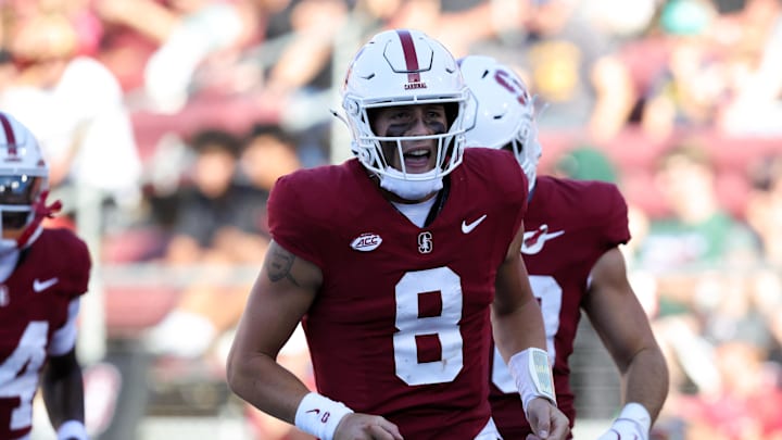 Sep 7, 2024; Stanford, California, USA; Stanford Cardinal quarterback Justin Lamson (8) celebrates after a touchdown against the Cal Poly Mustangs during the second quarter at Stanford Stadium. Mandatory Credit: Sergio Estrada-Imagn Images
