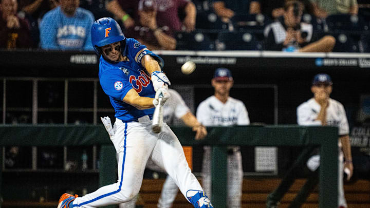 Jun 15, 2024; Omaha, NE, USA; Florida Gators second baseman Cade Kurland (4) flies out to right field against the Texas A&M Aggies during the ninth inning at Charles Schwab Field Omaha. Mandatory Credit: Dylan Widger-USA TODAY Sports