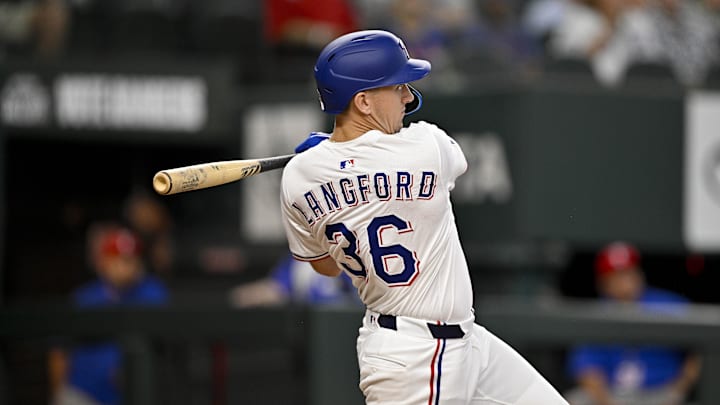 Jun 19, 2025; Arlington, Texas, USA; Texas Rangers left fielder Wyatt Langford (36) hits a single against the Kansas City Royals during the sixth inning at Globe Life Field.