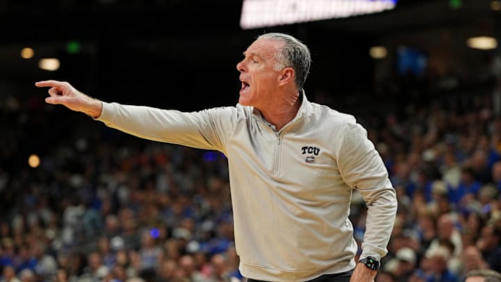 Mar 21, 2026; Greenville, SC, USA; Texas Christian University Horned Frogs head coach Jamie Dixon reacts after a play during the first half against the Duke Blue Devils during a second round game of the men's 2026 NCAA Tournament at Bon Secours Wellness Arena. Mandatory Credit: Bob Donnan-Imagn Images