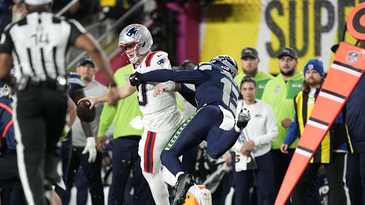 Feb 8, 2026; Santa Clara, CA, USA; Seattle Seahawks linebacker Ernest Jones IV (13) tackles New England Patriots quarterback Drake Maye (10) during the third quarter in Super Bowl LX at Levi's Stadium. Mandatory Credit: Kyle Terada-Imagn Images