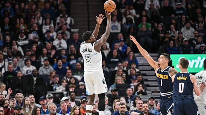 Minnesota Timberwolves guard Anthony Edwards shoots the ball over Denver Nuggets forward Michael Porter Jr. (1) as guard Christian Braun (0) look on during the second quarter at Target Center in Minneapolis on Jan. 25, 2025.