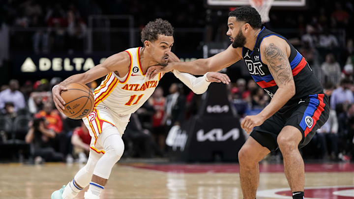 Mar 21, 2023; Atlanta, Georgia, USA; Atlanta Hawks guard Trae Young (11) dribbles defended by