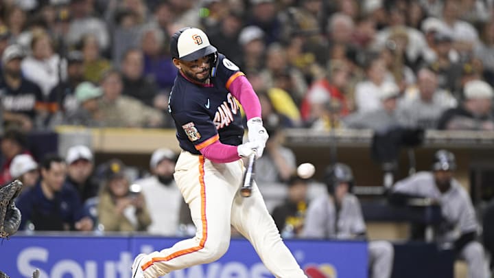 Apr 10, 2026; San Diego, California, USA; San Diego Padres catcher Luis Campusano (12) hits a solo home run during the fifth inning against the Colorado Rockies at Petco Park. Mandatory Credit: Denis Poroy-Imagn Images