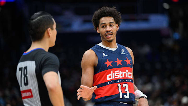 Jan 16, 2025; Washington, District of Columbia, USA; Washington Wizards guard Jordan Poole (13) talks to referee Evan Scott (78) during the first quarter of the game between the Washington Wizards and the Phoenix Suns at Capital One Arena. Mandatory Credit: Reggie Hildred-Imagn Images