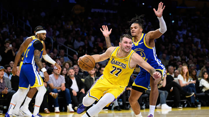 Oct 21, 2025; Los Angeles, California, USA; Los Angeles Lakers guard Luka Doncic (77) drives past Golden State Warriors guard Will Richard (3) during the first half at Crypto.com Arena. Mandatory Credit: William Liang-Imagn Images Oct 21, 2025; Los Angeles, California, USA; Los Angeles Lakers guard Luka Doncic (77) drives past Golden State Warriors guard Will Richard (3) during the first half at Crypto.com Arena. Mandatory Credit: William Liang-Imagn Images