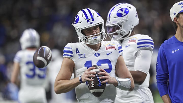 Dec 28, 2024; San Antonio, TX, USA; Brigham Young Cougars quarterback Jake Retzlaff (12) warms up before the game against the Colorado Buffaloes at Alamodome. Dec 28, 2024; San Antonio, TX, USA; Brigham Young Cougars quarterback Jake Retzlaff (12) warms up before the game against the Colorado Buffaloes at Alamodome.