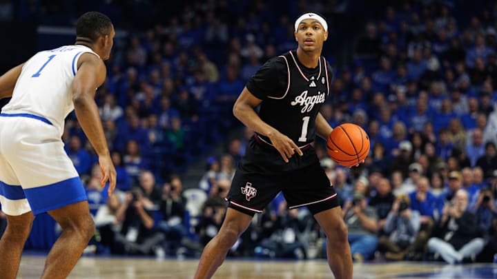 Jan 14, 2025; Lexington, Kentucky, USA; Texas A&M Aggies guard Zhuric Phelps (1) handles the ball during the first half against the Kentucky Wildcats at Rupp Arena at Central Bank Center. Mandatory Credit: Jordan Prather-Imagn Images