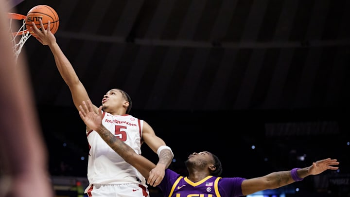 Feb 10, 2026; New Orleans, Louisiana, USA; Arkansas Razorbacks guard Darius Acuff Jr. (5) shoots against LSU Tigers guard Rashad King (4) during the first half at Smoothie King Center. Mandatory Credit: Matthew Hinton-Imagn Images