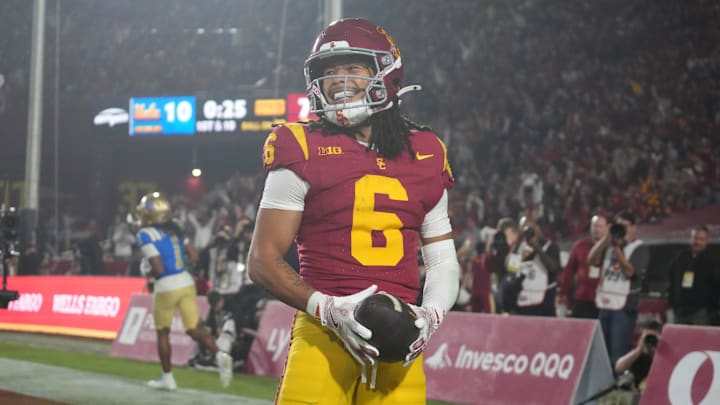 Nov 29, 2025; Los Angeles, California, USA; Southern California Trojans wide receiver Makai Lemon (6) celebrates after catching a 32-yard touchdown pass against the UCLA Bruins in the second half at United Airlines Field at Los Angeles Memorial Coliseum. Mandatory Credit: Kirby Lee-Imagn Images Nov 29, 2025; Los Angeles, California, USA; Southern California Trojans wide receiver Makai Lemon (6) celebrates after catching a 32-yard touchdown pass against the UCLA Bruins in the second half at United Airlines Field at Los Angeles Memorial Coliseum. Mandatory Credit: Kirby Lee-Imagn Images