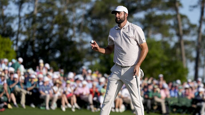 Apr 13, 2025; Augusta, Georgia, USA; Scottie Scheffler holds up his ball after finishing his round on no. 18 during the final round of the Masters Tournament at Augusta National Golf Club. Mandatory Credit: Kyle Terada-Imagn Images Apr 13, 2025; Augusta, Georgia, USA; Scottie Scheffler holds up his ball after finishing his round on no. 18 during the final round of the Masters Tournament at Augusta National Golf Club. Mandatory Credit: Kyle Terada-Imagn Images