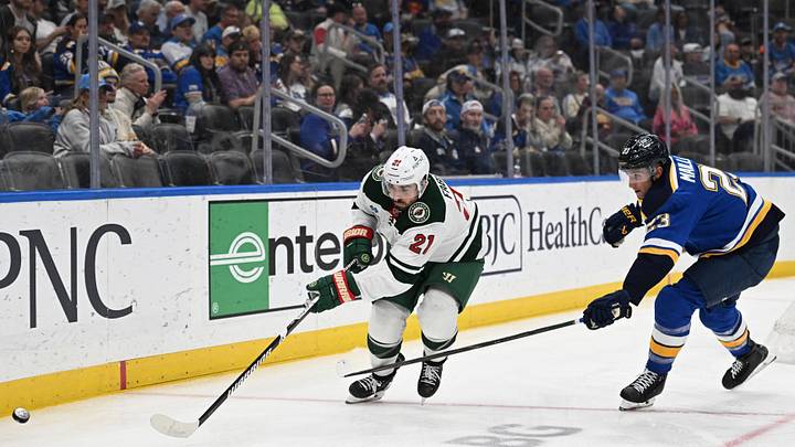 Apr 13, 2026; St. Louis, Missouri, USA; St. Louis Blues defenseman Logan Mailloux (23) defends against Minnesota Wild center Robby Fabbri (21) in the third period at Enterprise Center. Mandatory Credit: Joe Puetz-Imagn Images Apr 13, 2026; St. Louis, Missouri, USA; St. Louis Blues defenseman Logan Mailloux (23) defends against Minnesota Wild center Robby Fabbri (21) in the third period at Enterprise Center. Mandatory Credit: Joe Puetz-Imagn Images