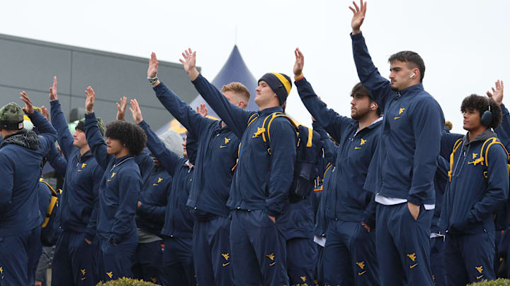 WVU Football waving to the WVU Children's Hospital.