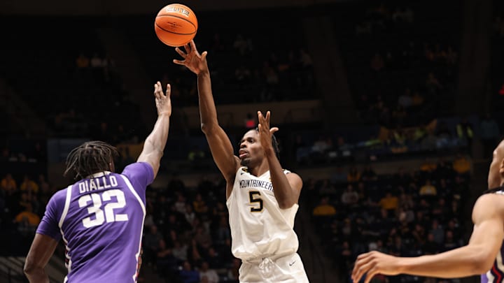 West Virginia University guard Toby Okani