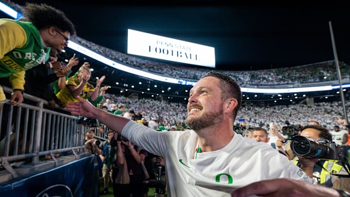 Oregon head coach Dan Lanning celebrates his win with Duck fans as the Oregon Ducks face the Penn State Nittany Lions on Sept. 27, 2025, at Beaver Stadium in University Park, Pennsylvania. Oregon head coach Dan Lanning celebrates his win with Duck fans as the Oregon Ducks face the Penn State Nittany Lions on Sept. 27, 2025, at Beaver Stadium in University Park, Pennsylvania.