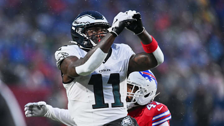 Dec 28, 2025; Orchard Park, New York, USA; Philadelphia Eagles wide receiver A.J. Brown (11) prepares to catch a pass against Buffalo Bills cornerback Christian Benford (47) during the first quarter at Highmark Stadium.