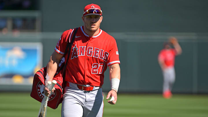Feb 22, 2026; Salt River Pima-Maricopa, Arizona, USA; Los Angeles Angels center fielder Mike Trout (27) brings his gear to the dugout for the game against the Arizona Diamondbacks at Salt River Fields at Talking Stick. Mandatory Credit: Jayne Kamin-Oncea-Imagn Images