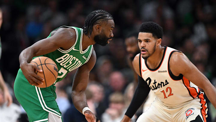 Dec 4, 2024; Boston, Massachusetts, USA; Boston Celtics guard Jaylen Brown (7) drives to the basket against Detroit Pistons forward Tobias Harris (12) during the first quarter at the TD Garden. Mandatory Credit: Brian Fluharty-Imagn Images
