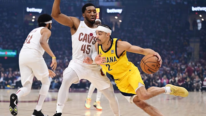 Indiana Pacers guard Andrew Nembhard (2) drives to the basket against Cleveland Cavaliers guard Donovan Mitchell (45) during the first quarter in game one of the second round for the 2025 NBA Playoffs at Rocket Arena. Indiana Pacers guard Andrew Nembhard (2) drives to the basket against Cleveland Cavaliers guard Donovan Mitchell (45) during the first quarter in game one of the second round for the 2025 NBA Playoffs at Rocket Arena.