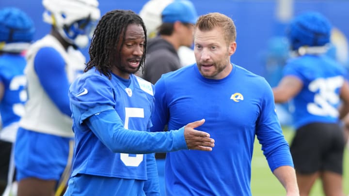 May 28, 2025; Woodland Hills, CA, USA; Los Angeles Rams wide receiver Tutu Atwell (5) talks to head coach Sean McVey during organized team activities at Rams Practice Facility. Mandatory Credit: Kirby Lee-Imagn Images May 28, 2025; Woodland Hills, CA, USA; Los Angeles Rams wide receiver Tutu Atwell (5) talks to head coach Sean McVey during organized team activities at Rams Practice Facility. Mandatory Credit: Kirby Lee-Imagn Images