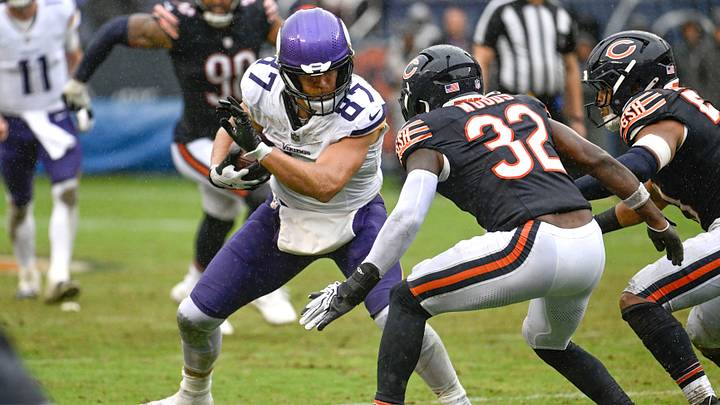 T.J. Hockenson looks for yardage as Xavier Woods closes in for the Bears in Sunday's 9-3 Vikings win. T.J. Hockenson looks for yardage as Xavier Woods closes in for the Bears in Sunday's 9-3 Vikings win.