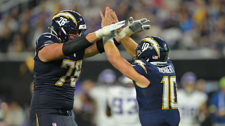 Los Angeles Chargers QB Justin Herbert (10) reacts with OT Joe Alt (76) against the Minnesota Vikings at SoFi Stadium Los Angeles Chargers QB Justin Herbert (10) reacts with OT Joe Alt (76) against the Minnesota Vikings at SoFi Stadium