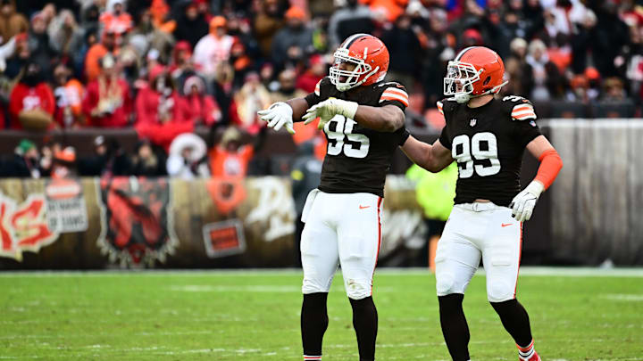 Nov 30, 2025; Cleveland, Ohio, USA;  Cleveland Browns defensive end Myles Garrett (95) and Cleveland Browns defensive end Cameron Thomas (99) celebrate after a play during the second half against the San Francisco 49ers at Huntington Bank Field. Mandatory Credit: Ken Blaze-Imagn Images