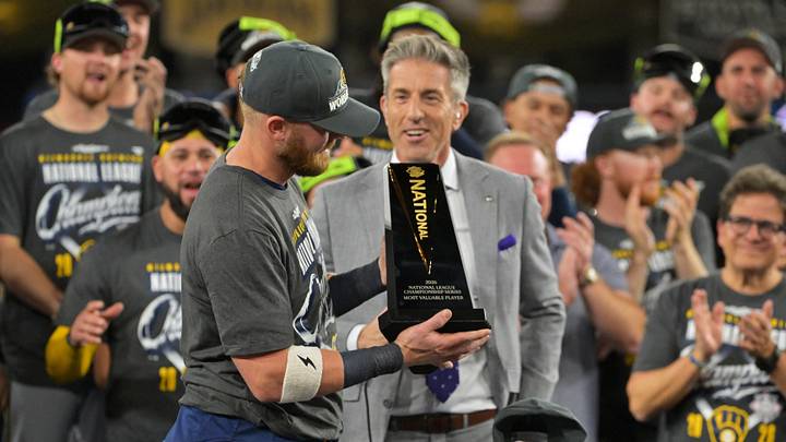 Oct 15, 2026; Los Angeles, California, USA; Milwaukee Brewers first baseman Jake Bauers (9) receives the MVP trophy after defeating the Los Angeles Dodgers in game four of the NLCS for the 2026 MLB playoffs at Uniqlo Field at Dodger Stadium. Mandatory Credit: Jayne Kamin-Oncea-Imagn Images Oct 15, 2026; Los Angeles, California, USA; Milwaukee Brewers first baseman Jake Bauers (9) receives the MVP trophy after defeating the Los Angeles Dodgers in game four of the NLCS for the 2026 MLB playoffs at Uniqlo Field at Dodger Stadium. Mandatory Credit: Jayne Kamin-Oncea-Imagn Images