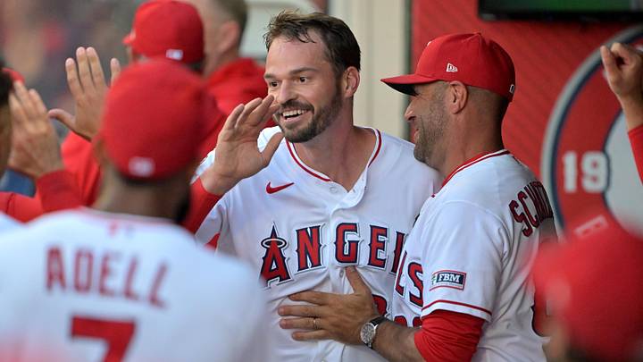 The Angels' Trey Mancini (34) is greeted in the dugout after scoring a run in the second inning against the Houston Astros at Angel Stadium June 8. The Angels' Trey Mancini (34) is greeted in the dugout after scoring a run in the second inning against the Houston Astros at Angel Stadium June 8.