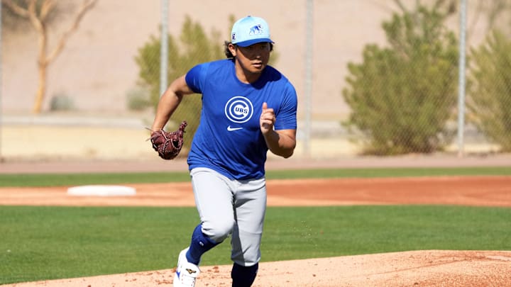 Feb 10, 2025; Mesa, AZ, USA; Chicago Cubs pitcher Shota Imanaga (18) runs through drills during spring training camp. Feb 10, 2025; Mesa, AZ, USA; Chicago Cubs pitcher Shota Imanaga (18) runs through drills during spring training camp.