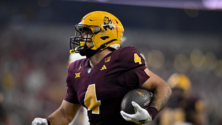 Dec 7, 2024; Arlington, TX, USA; Arizona State Sun Devils running back Cam Skattebo (4) scores a rushing touchdown against the Iowa State Cyclones during the second half at AT&T Stadium.