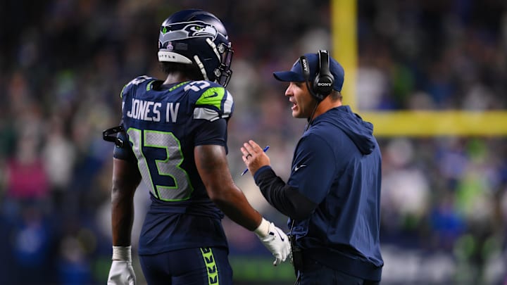 Oct 20, 2025; Seattle, Washington, USA; Seattle Seahawks linebacker Ernest Jones IV (13) talks with Seattle Seahawks head coach Mike Macdonald during the fourth quarter against the Houston Texans at Lumen Field. Mandatory Credit: Steven Bisig-Imagn Images
