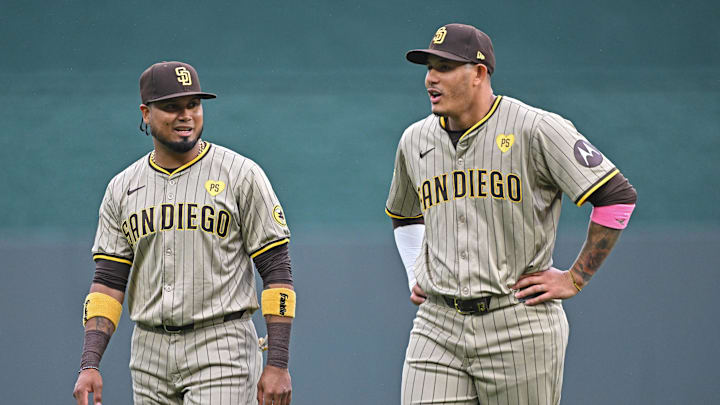 May 31, 2024; Kansas City, Missouri, USA;  San Diego Padres third baseman Manny Machado (right) and first baseman Luis Arraez (left) talk before a game against the Kansas City Royals at Kauffman Stadium. Mandatory Credit: Peter Aiken-Imagn Images