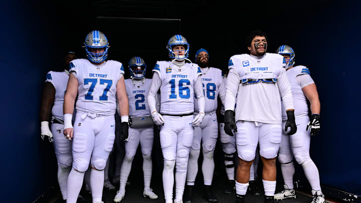 Dec 22, 2024; Chicago, Illinois, USA; Detroit Lions center Frank Ragnow (77), quarterback Jared Goff (16), and offensive tackle Penei Sewell (58) stand in the tunnel before the game against the Chicago Bears at Soldier Field. Mandatory Credit: Daniel Bartel-Imagn Images