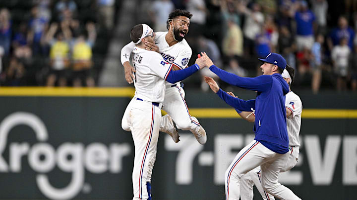 Texas Rangers catcher Danny Jansen (9) and second baseman Ezequiel Duran (20) and starting pitcher MacKenzie Gore (1) and center fielder Sam Haggerty (0) celebrate after Jansen hits a single and drives in the game winning run against the Arizona Diamondbacks. Texas Rangers catcher Danny Jansen (9) and second baseman Ezequiel Duran (20) and starting pitcher MacKenzie Gore (1) and center fielder Sam Haggerty (0) celebrate after Jansen hits a single and drives in the game winning run against the Arizona Diamondbacks.
