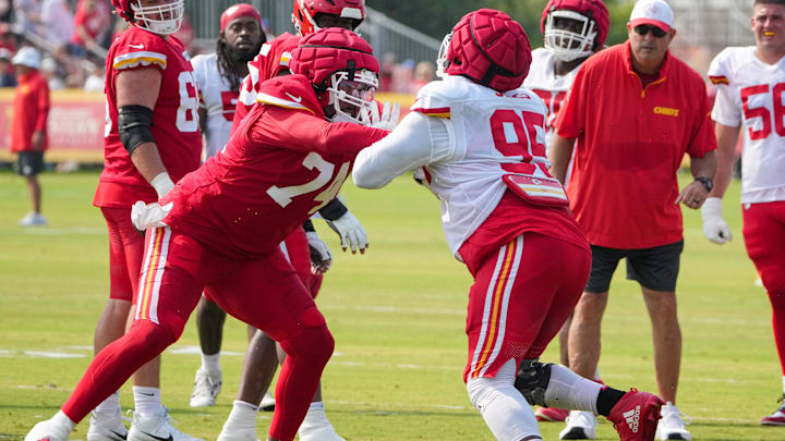 Jul 26, 2024; Kansas City, MO, USA; Kansas City Chiefs offensive tackle Jawaan Taylor (74) and defensive tackle Chris Jones (95) run drills during training camp at Missouri Western State University. Mandatory Credit: Denny Medley-USA TODAY Sports