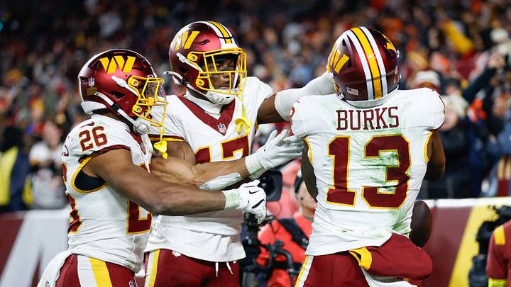 Nov 30, 2025; Landover, Maryland, USA; Washington Commanders wide receiver Treylon Burks (13) celebrates after scoring a touchdown against the Denver Broncos with running back Jeremy McNichols (26) and wide receiver Terry McLaurin (17) in the third quarter of the game at Northwest Stadium. Mandatory Credit: Peter Casey-Imagn Images