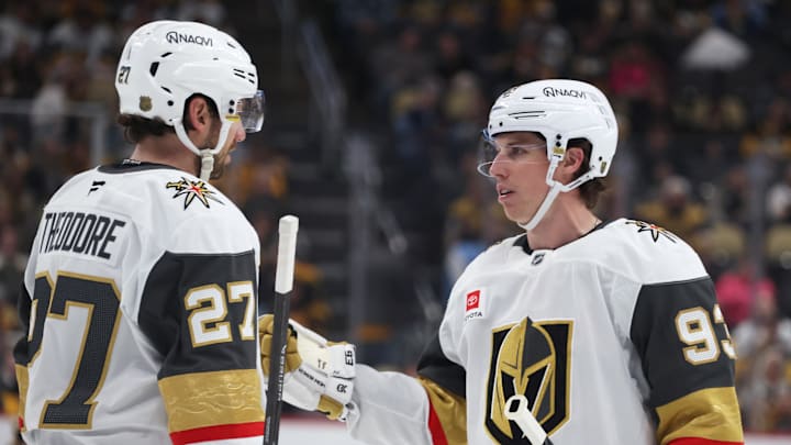 Mar 1, 2026; Pittsburgh, Pennsylvania, USA;  Vegas Golden Knights defenseman Shea Theodore (27) and right wing Mitch Marner (93) talk on the ice against the Pittsburgh Penguins during the third period at PPG Paints Arena. Mandatory Credit: Charles LeClaire-Imagn Images
