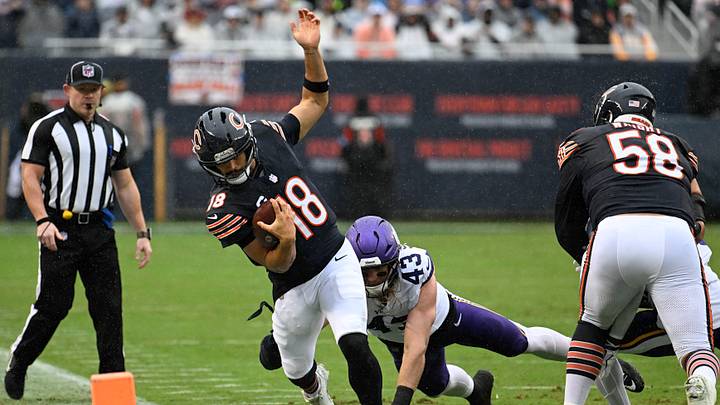 Sep 20, 2026; Chicago, Illinois, USA; Chicago Bears quarterback Caleb Williams (18) runs from Minnesota Vikings linebacker Andrew van Ginkel (43) during the first half at Soldier Field. Matt Marton-Imagn Images