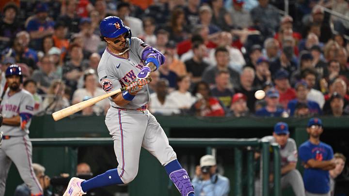 May 19, 2026; Washington, District of Columbia, USA;  New York Mets third baseman Mark Vientos (27) hits the ball into play against the Washington Nationals during the fifth inning at Nationals Park. Mandatory Credit: Rafael Suanes-Imagn Images
