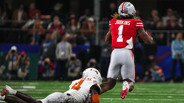Ohio State running back Quinshon Judkins (1) is tackled by Texas Longhorns defensive back Andrew Mukuba (4) during the College Football Playoff semifinal game in the Cotton Bowl at AT&T Stadium on Friday, Jan. 10, 2024 in Arlington, Texas. Ohio State running back Quinshon Judkins (1) is tackled by Texas Longhorns defensive back Andrew Mukuba (4) during the College Football Playoff semifinal game in the Cotton Bowl at AT&T Stadium on Friday, Jan. 10, 2024 in Arlington, Texas.